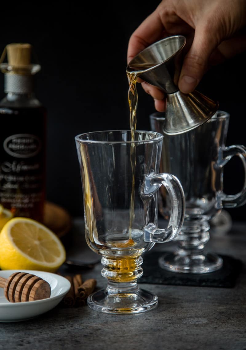 Pouring Cognac into a glass
