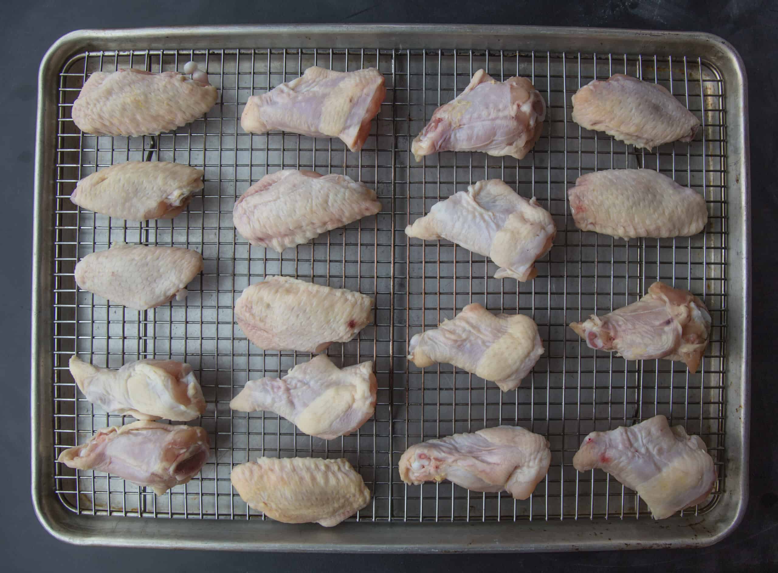 wings on a drying rack and sheet pan getting ready to dehydrate in the refirgerator.