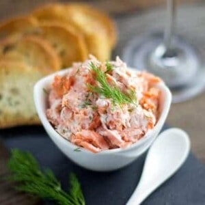 Smoked Salmon Dip with crostini in a cup.