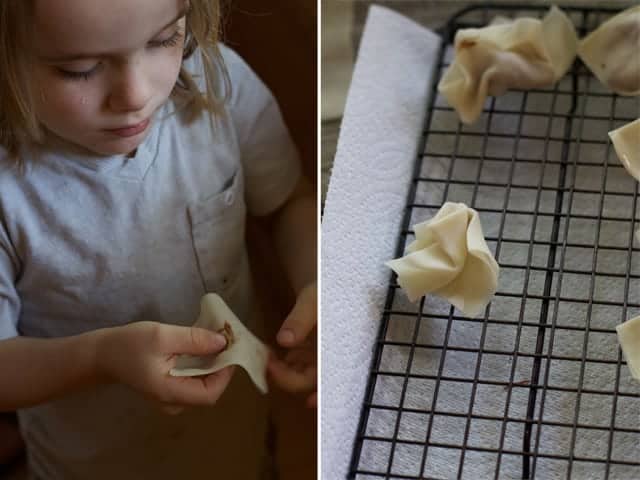 Kids helping to wrap wontons