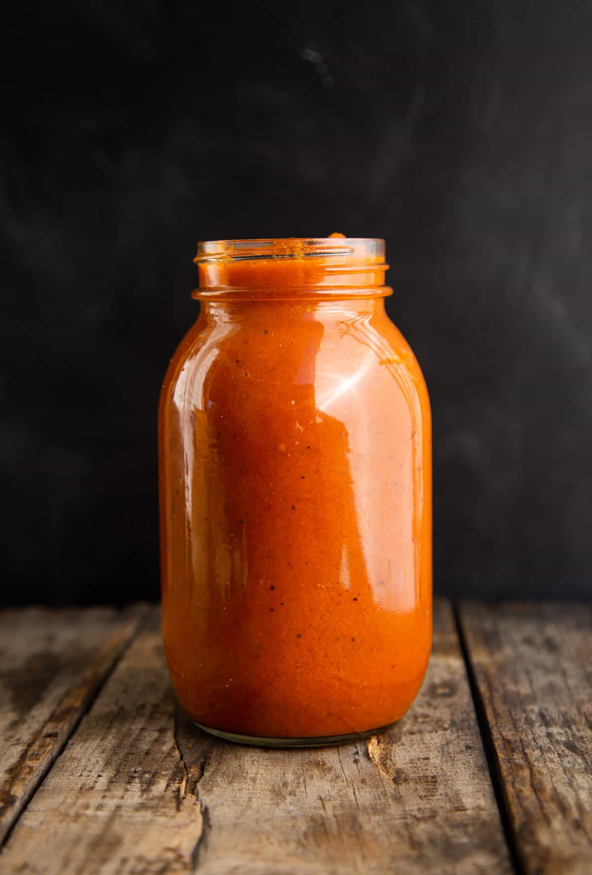 A mason jar with smoked tomato sauce