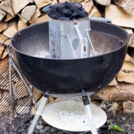 Place charcoal in the chimney starter with paper on the bottom.