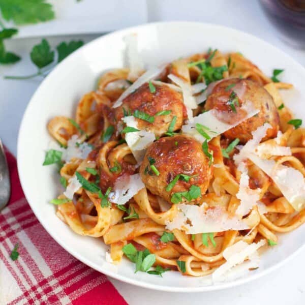 Smoked Turkey Meatballs with Bacon Paste over a bowl of pasta