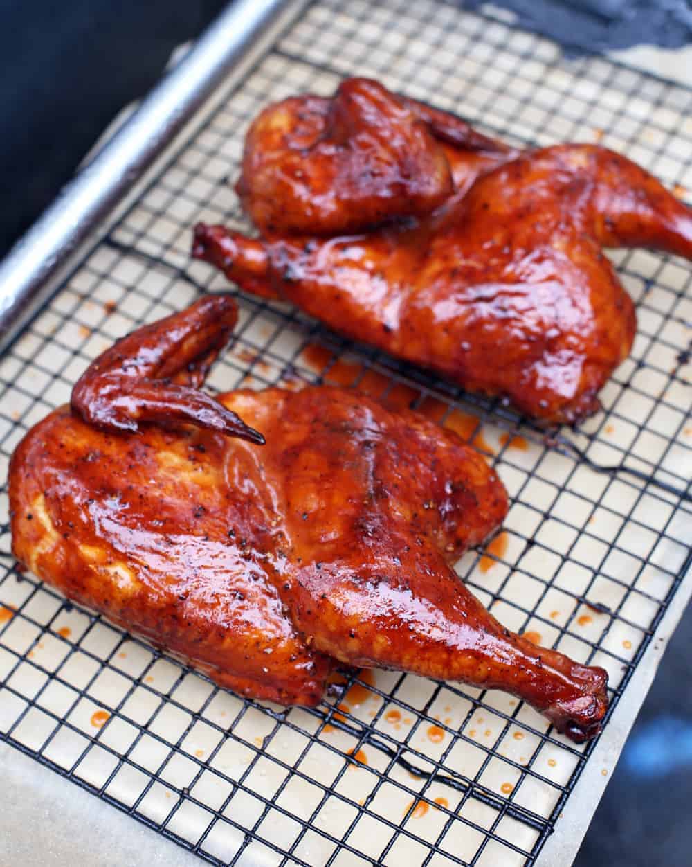 Dry Brined Smoked Chicken with a Carolina BBQ Glazed on a cooling rack 