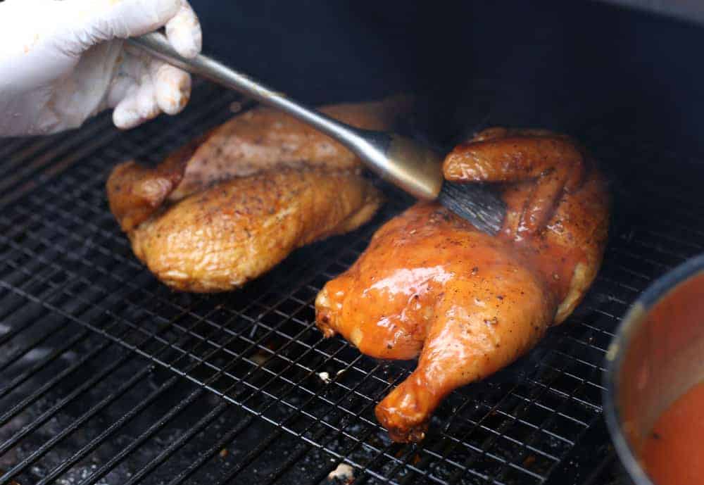 Glazing a Smoked Chicken on a grill