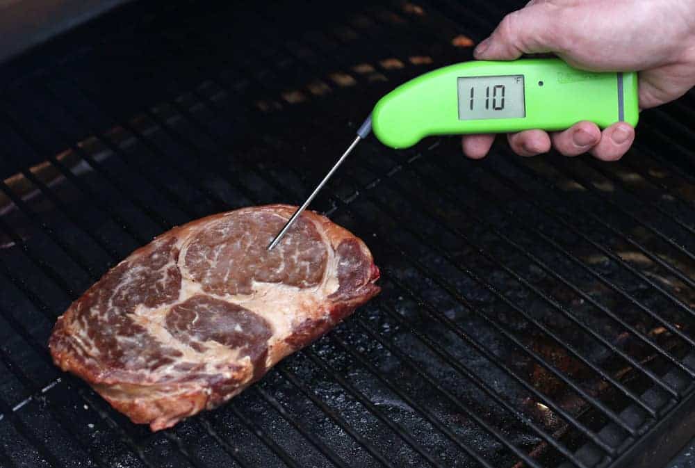 Taking the temperature of a steak using a digital thermometer