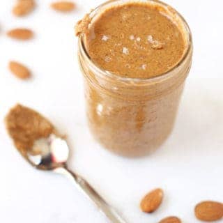Smoked almond butter in a mason jar topped with salt.