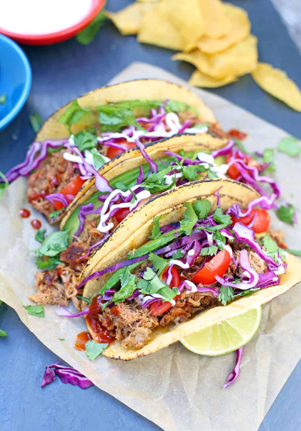 Pulled Pork Tacos made with leftover smoked pork and topped with cabbage, tomatoes and cilantro