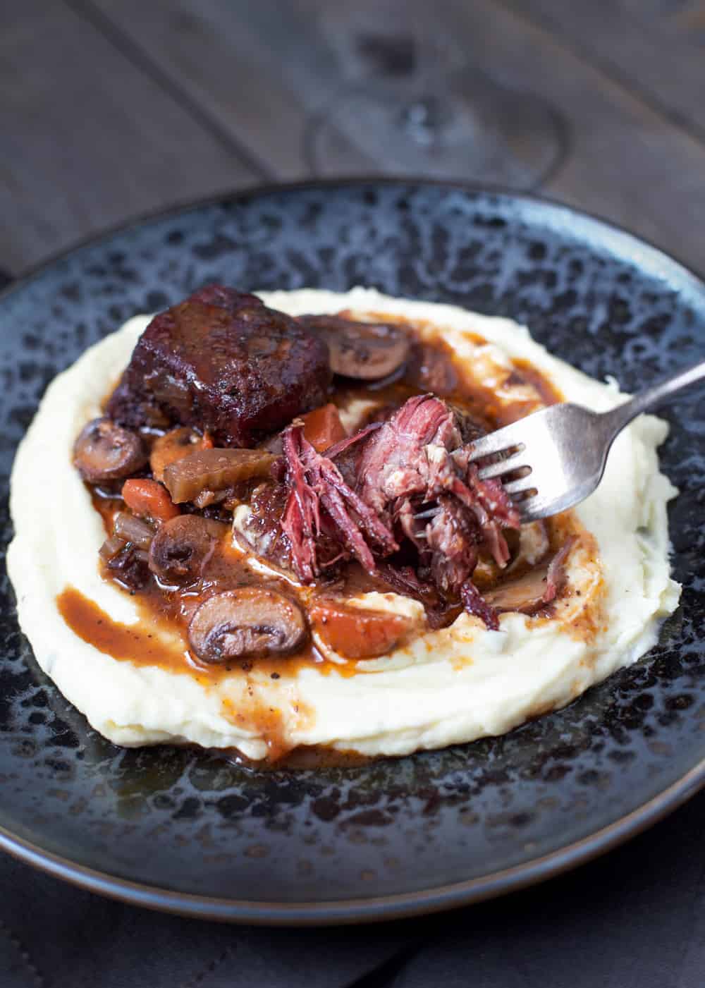 A plate of Smoked Beef Short Rib Stew. 