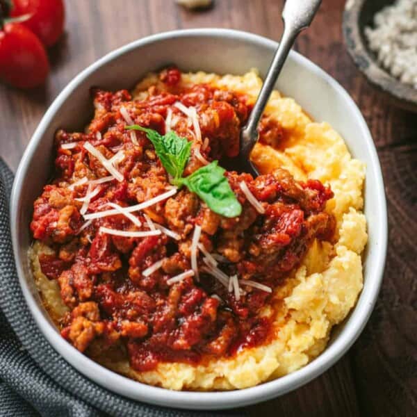 Smoked sausage ragu sauce served over creamy polenta.