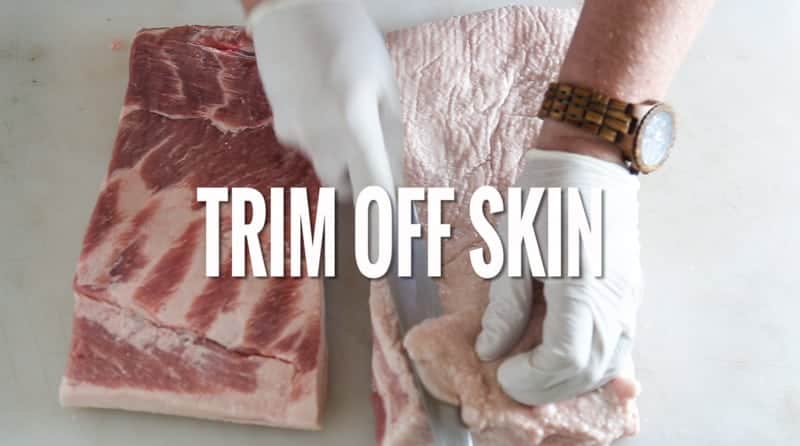 An image from a video with text saying "trim off skin"