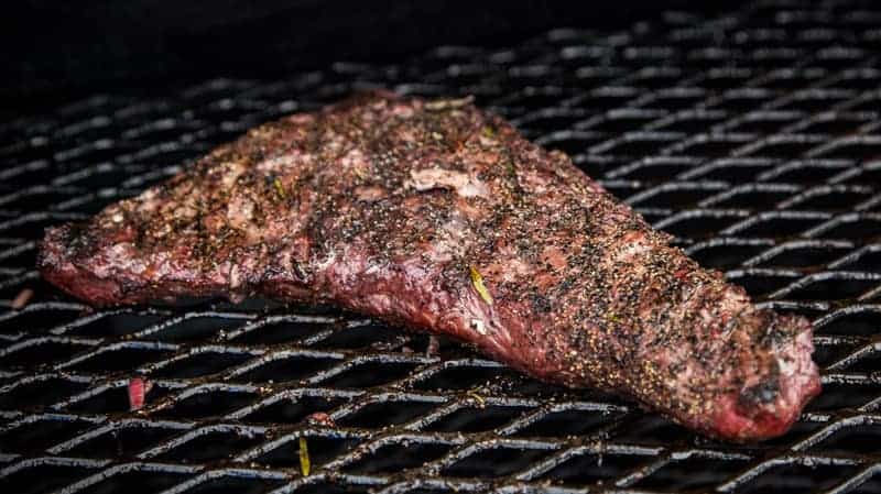 A whole Tri Tip cooking on a smoker