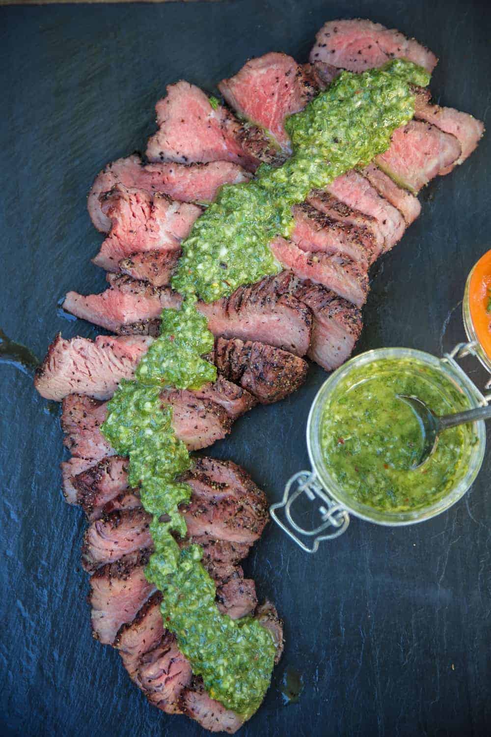 Slices of Red Wine Marinated Smoked Tri Tip with Chimichurri Sauce