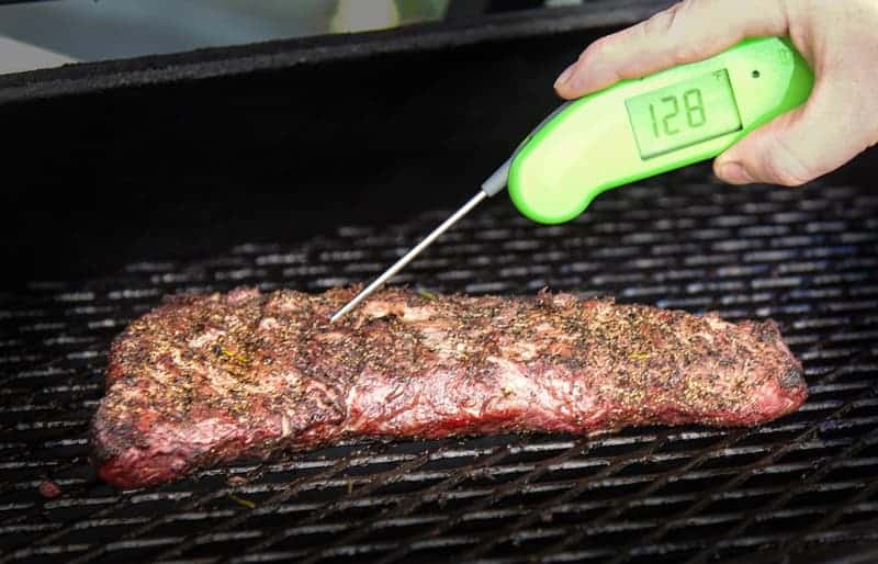 Checking temperature of beef with a digital thermometer