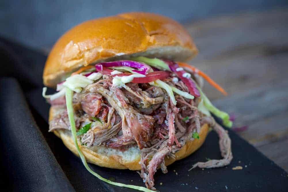Pulled Lamb Sandwich topped with aioli and slaw