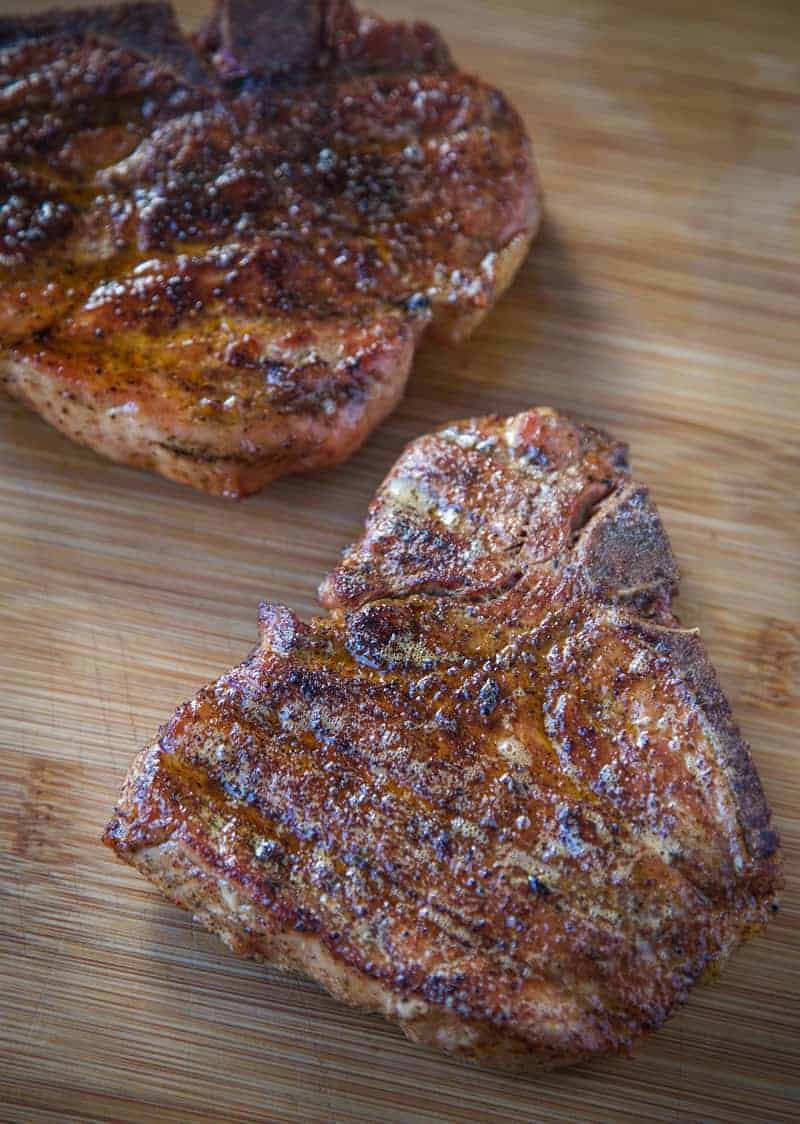 Reverse Seared Smoked Pork Chop on a cutting board