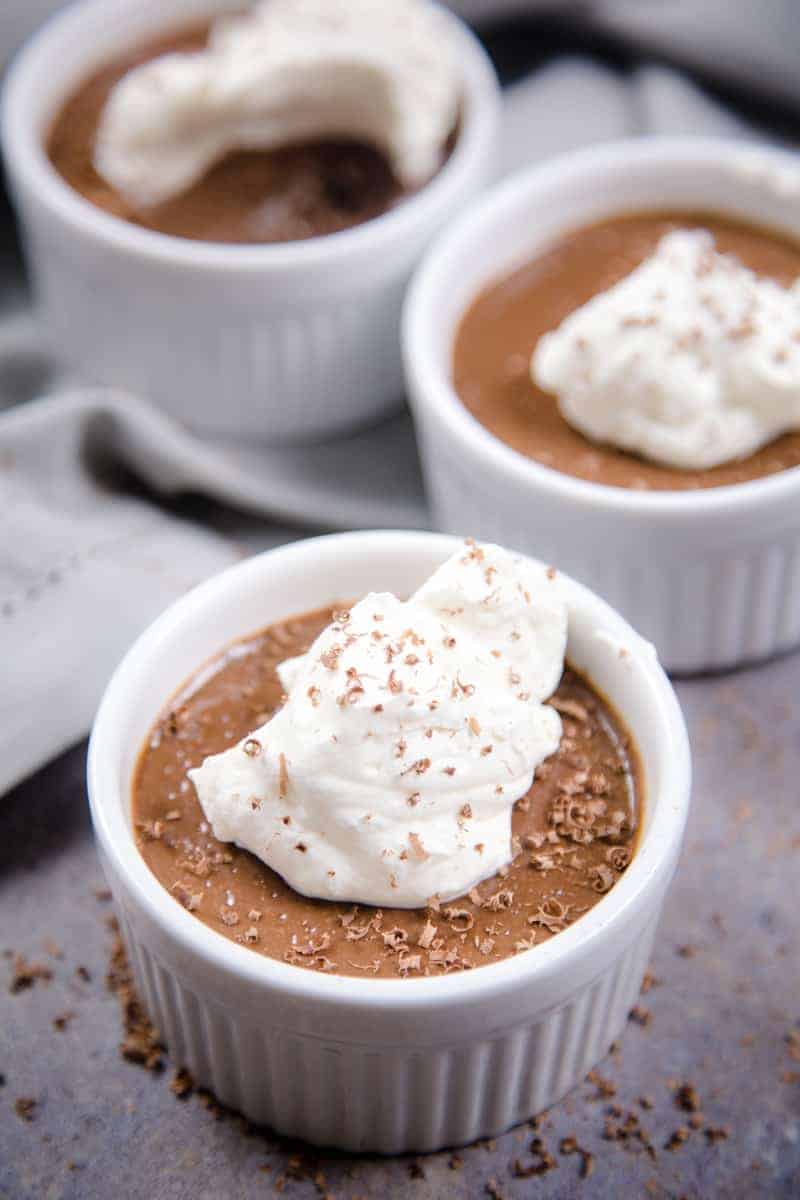 Smoked Chocolate Pot de Crème in a ramekin topped with whipped cream 