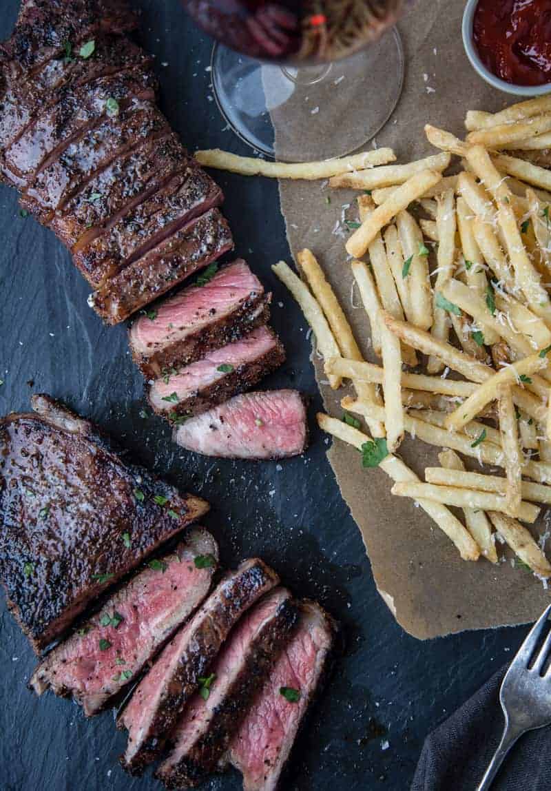 Grilled Coffee Dry Rubbed NY Strip Steak with french fries.