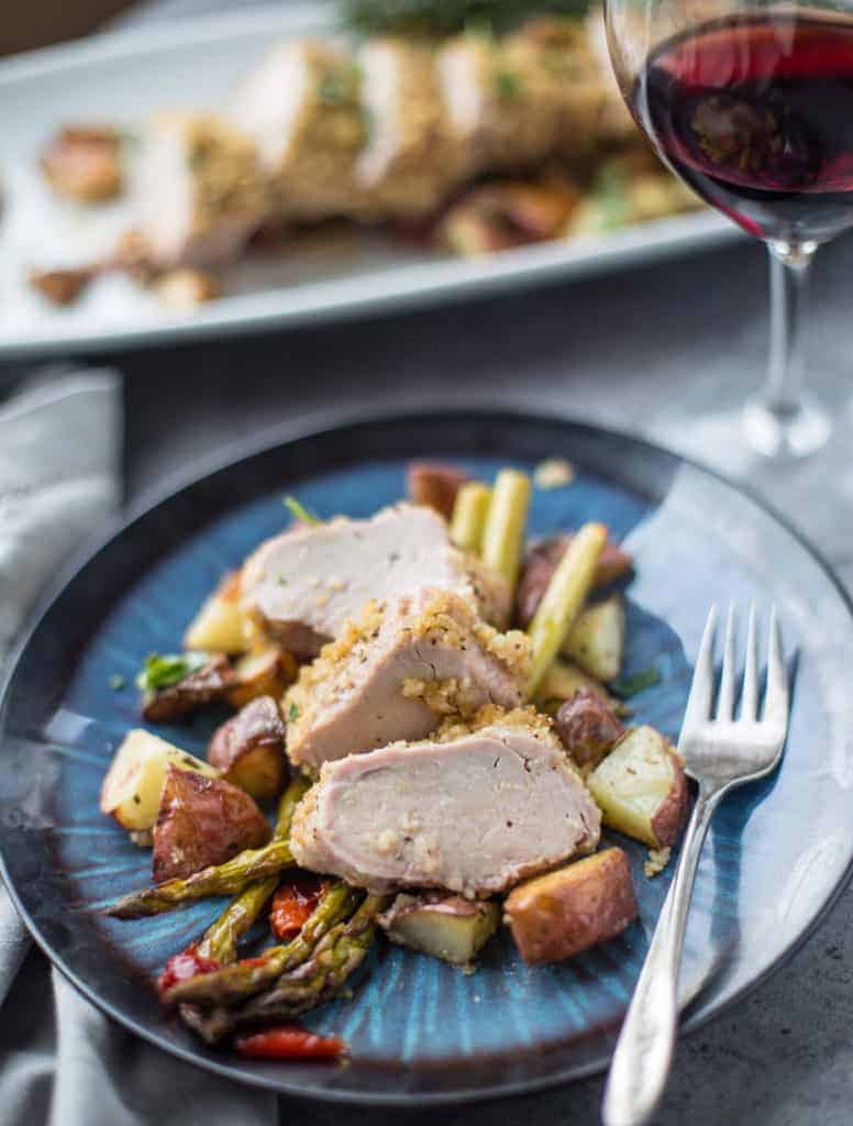 Pork Tenderloin slices and a glass of wine