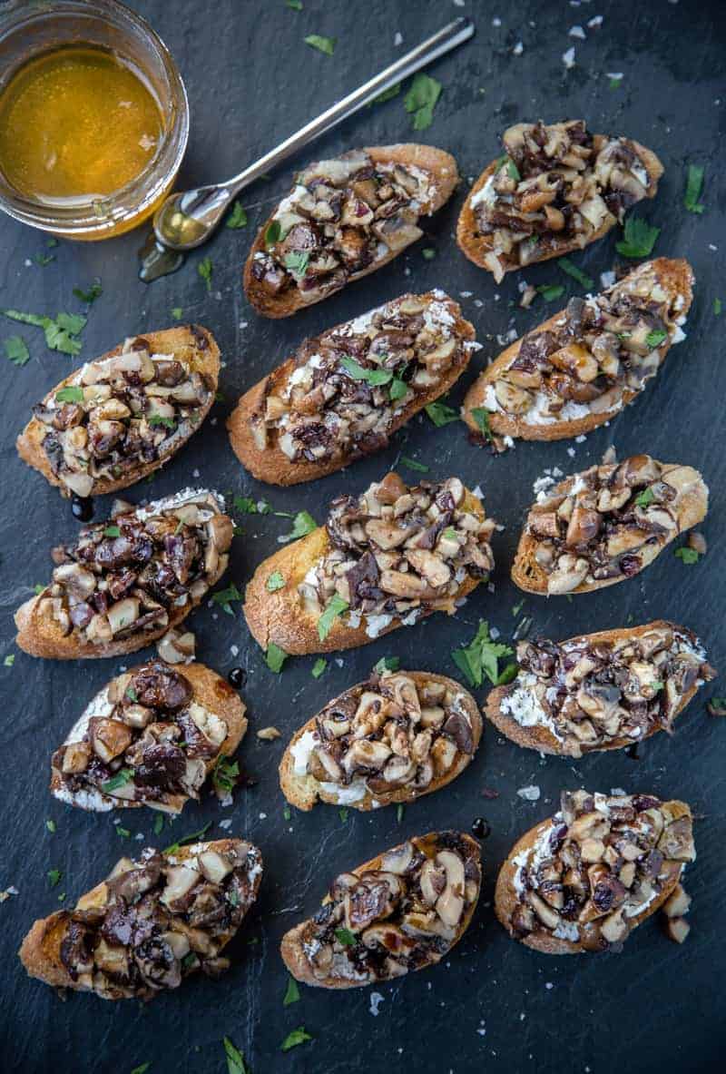 Grilled Mushroom Crostini with Smoked Honey and Aged Balsamic on a slate platter