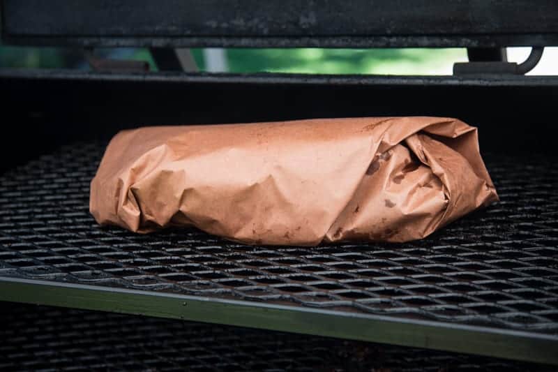 Brisket wrapped in pink butcher paper