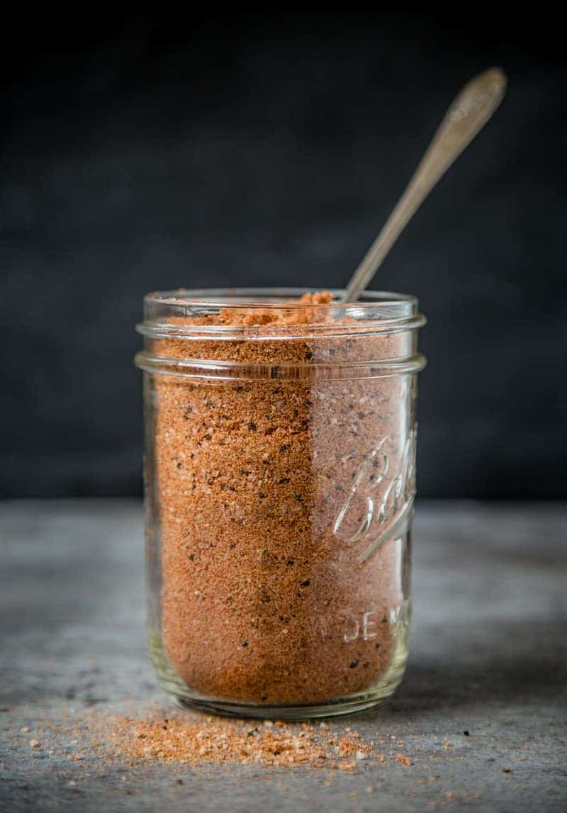 A mason jar of Homemade All Purpose Seasoning (or dry rub)