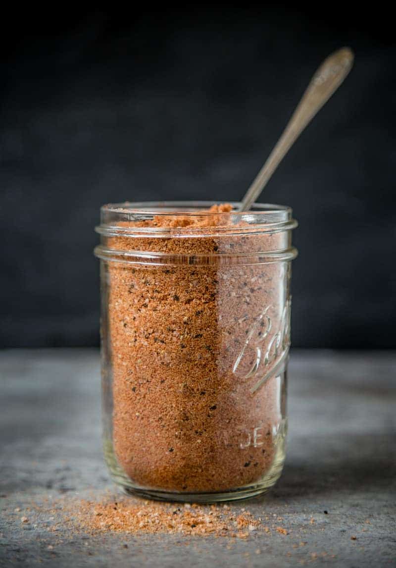 A mason jar of Homemade All Purpose Seasoning (or dry rub)