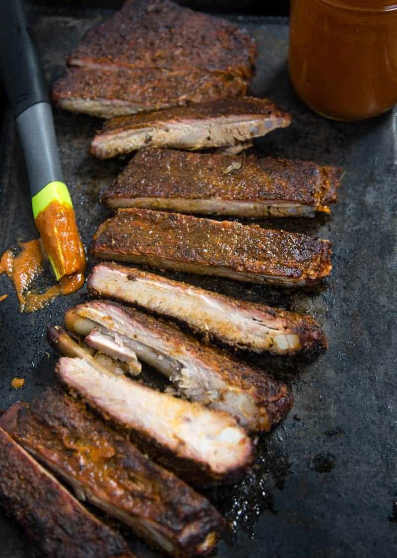 No Sugar Added Smoked Pork Ribs (Keto and Paleo Friendly) sliced up on a serving platter