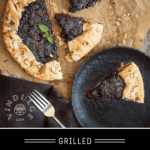 A Grilled Blackberry Crostata on a sheet of butcher paper with a slice of blackberry crostata on a plate