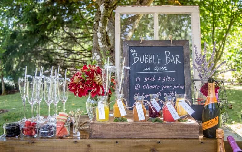 A table decorated with Mimosa Bar ingredients and supplies
