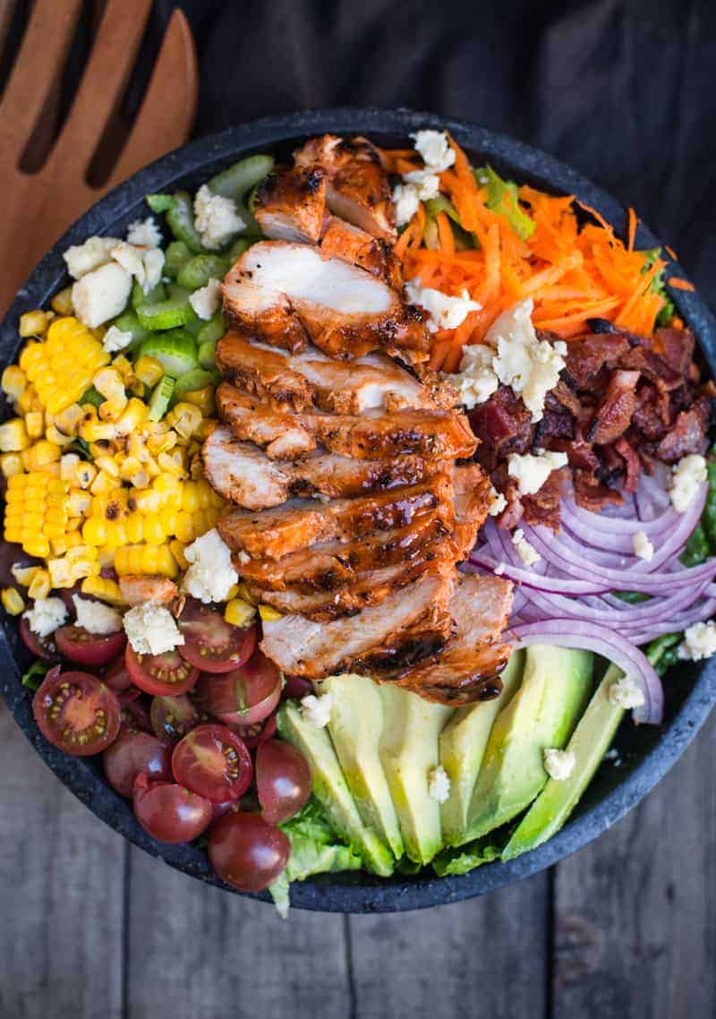 Grilled Buffalo Chicken Salad in a large black serving bowl