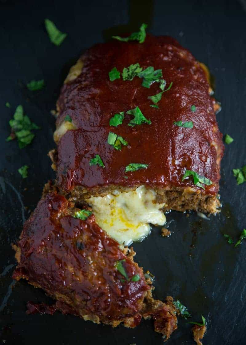 Smoked (BBQ) Stuffed Meatloaf on a black platter