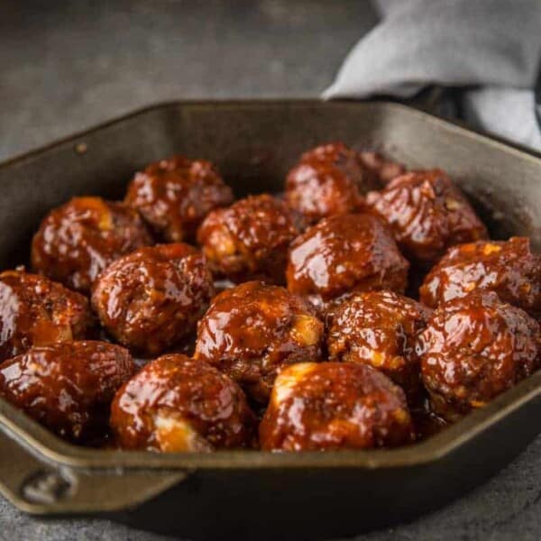 Smoked Stuffed BBQ Meatballs in a cast iron pan