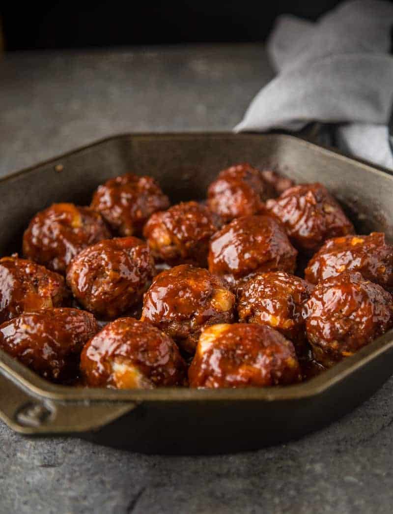 Smoked Stuffed BBQ Meatballs in a cast iron pan