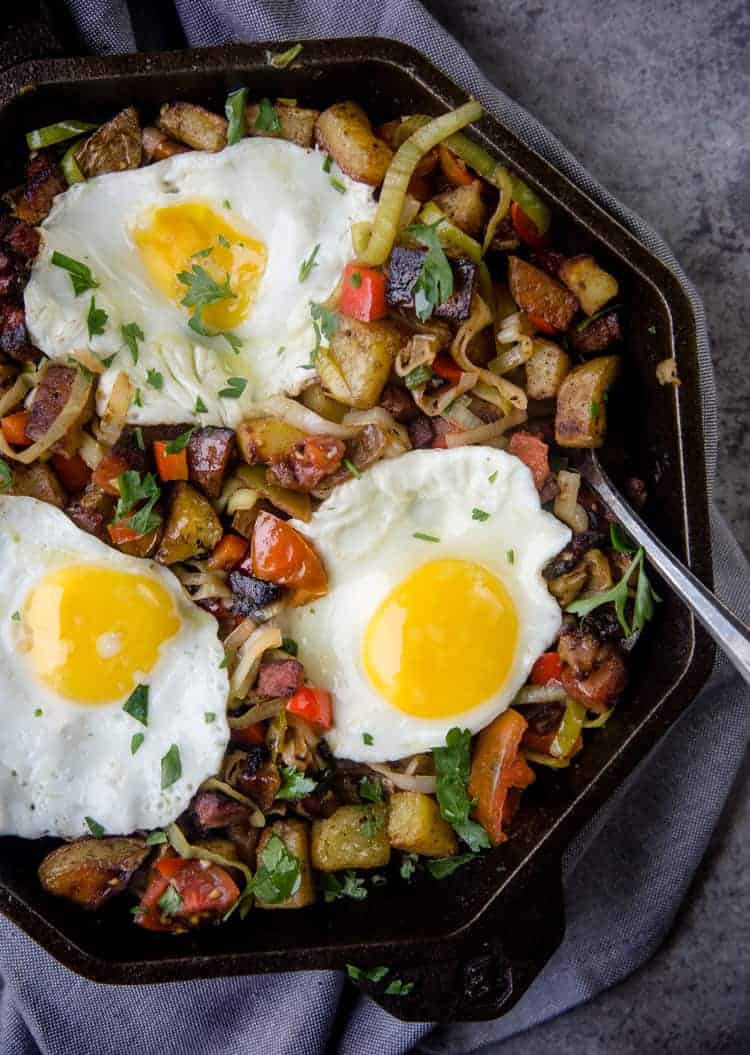 Smoked Ham Breakfast Hash cooked in a cast iron pan