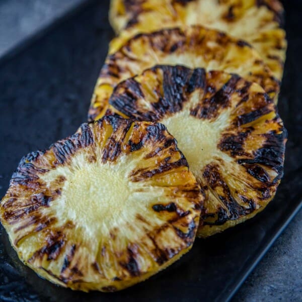 Grilled Pineapple slices on a serving dish