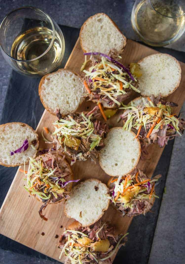 Pulled Pork Sandwiches Hawaiian Style on a platter with Riesling wine