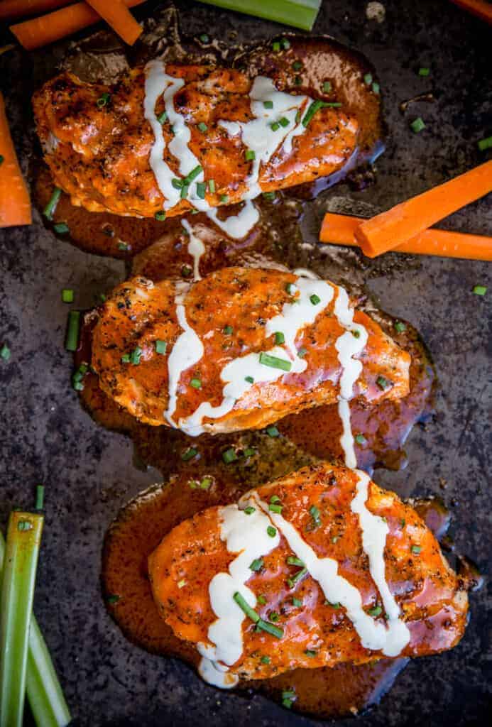 Buffalo Stuffed Grilled Chicken Breasts on a sheet pan