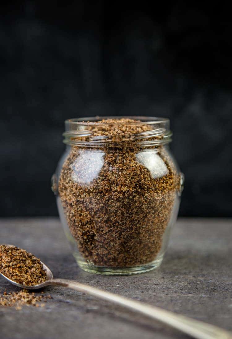 Coffee Rub with ancho chile powder in a glass jar.