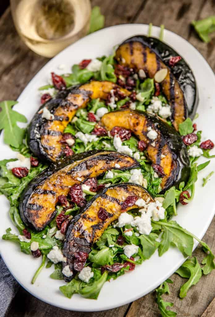 Grilled Acorn Squash over a bed of arugula.