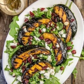 Grilled Acorn Squash over a bed of arugula.