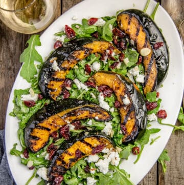 Grilled Acorn Squash over a bed of arugula.