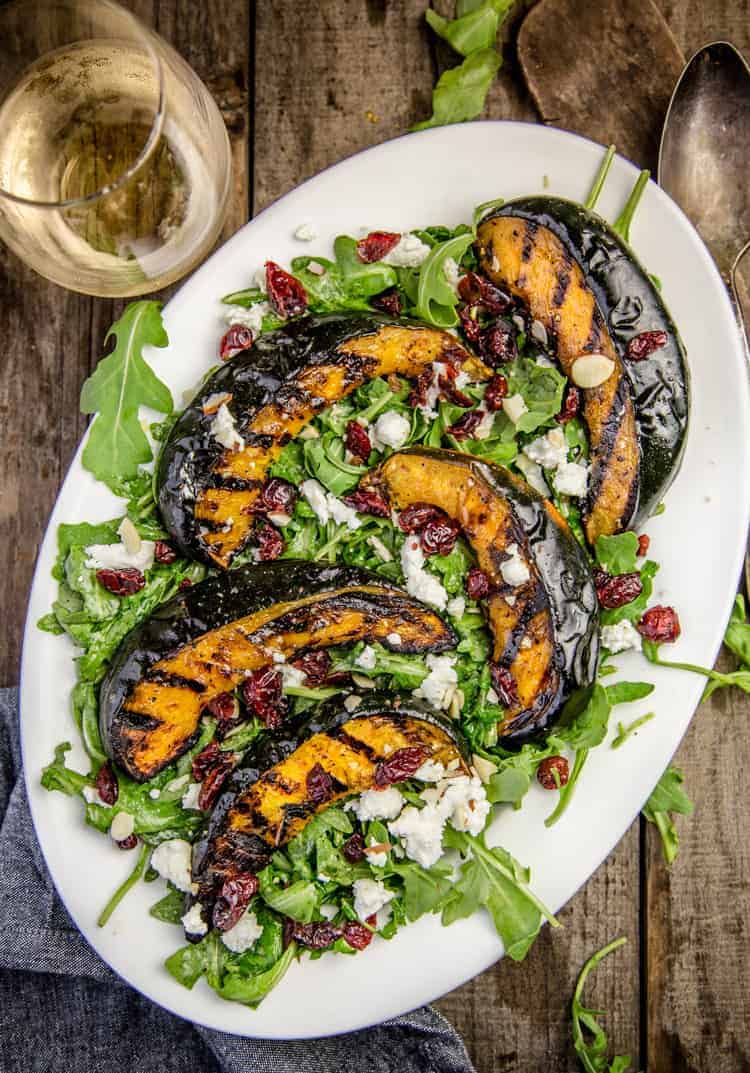 Grilled Acorn Squash Salad tossed with arugula and a citrus vinaigrette. 