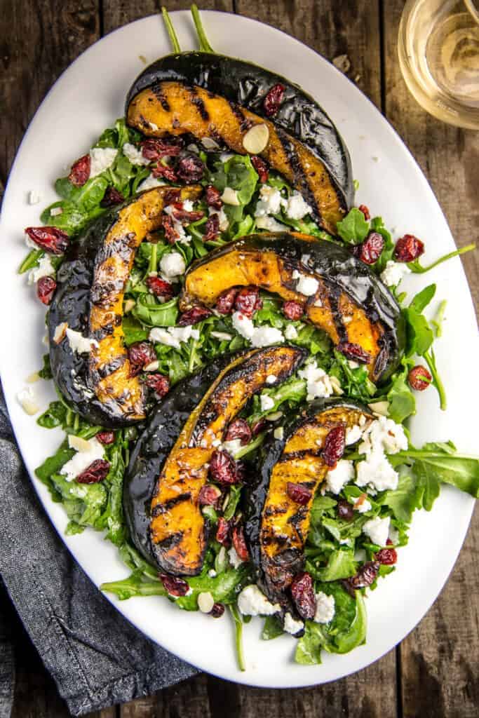 Grilled Acorn Squash over a bed of arugula.