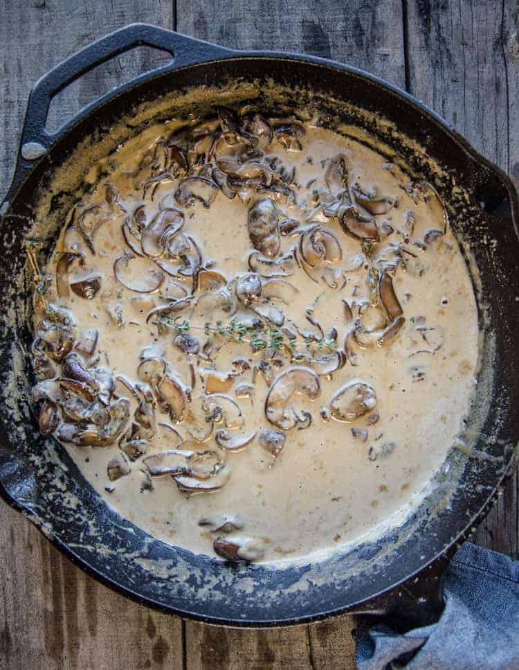 Mushroom Cream sauce in a cast iron pan. 