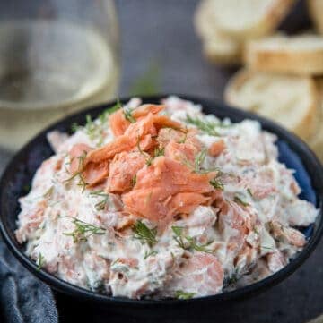 Smoked salmon dip spread in a large dish.