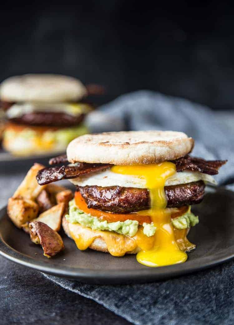 Two Breakfast Sandwiches with Smoked Sausage and Bacon