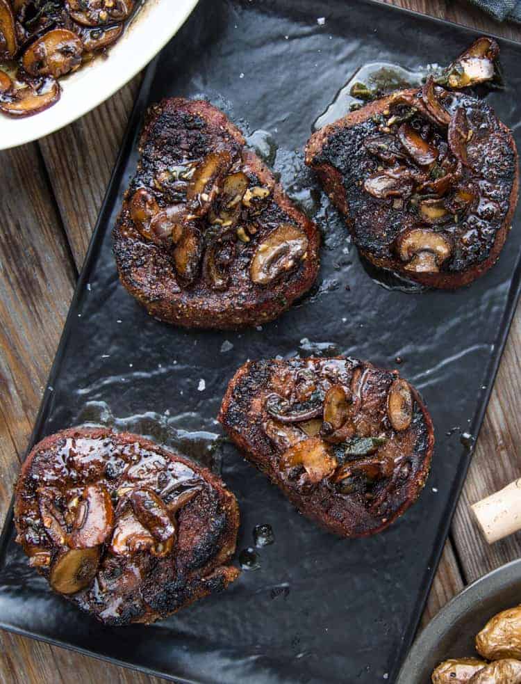 grilled steaks topped with mushroom brown butter sauce