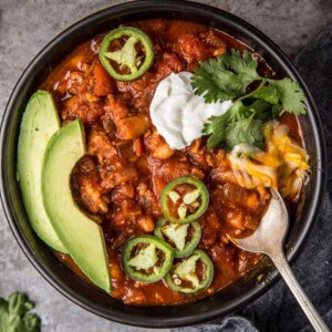 Chili in bowl with toppings