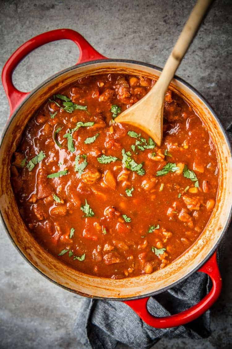 A pot of Turkey Chili with a spoon in it